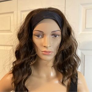 Wavy brown synthetic wig with attached Stretchy headband. Velcro closing.